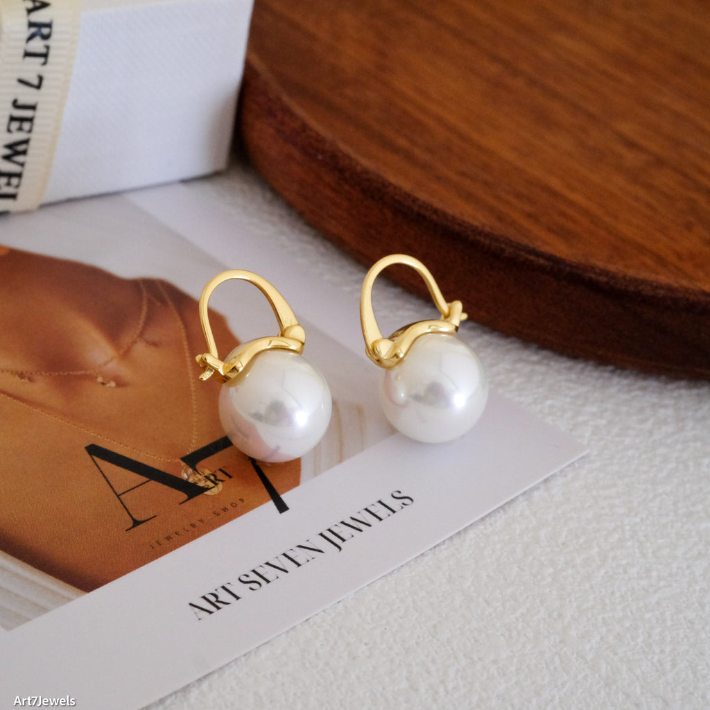 12mm white pearl earrings, crafted to enhance any outfit with their stunning luster. Perfect for everyday wear or special occasions like weddings and bridesmaid ensembles