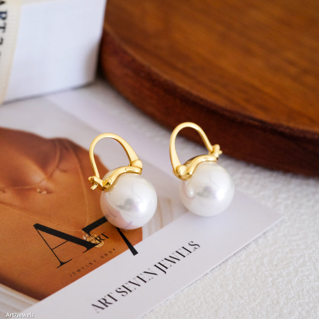 12mm white pearl earrings, crafted to enhance any outfit with their stunning luster. Perfect for everyday wear or special occasions like weddings and bridesmaid ensembles