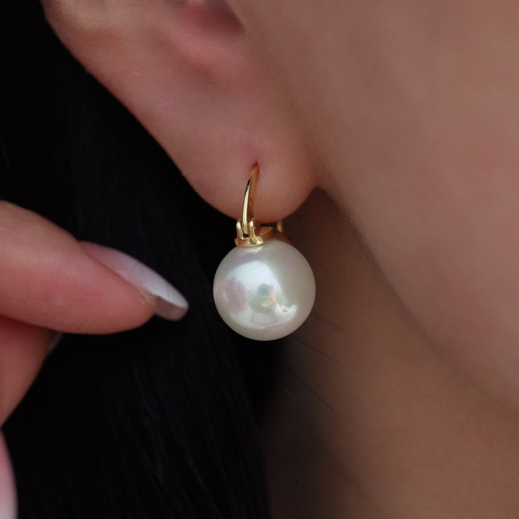 12mm white pearl earrings, crafted to enhance any outfit with their stunning luster. Perfect for everyday wear or special occasions like weddings and bridesmaid ensembles