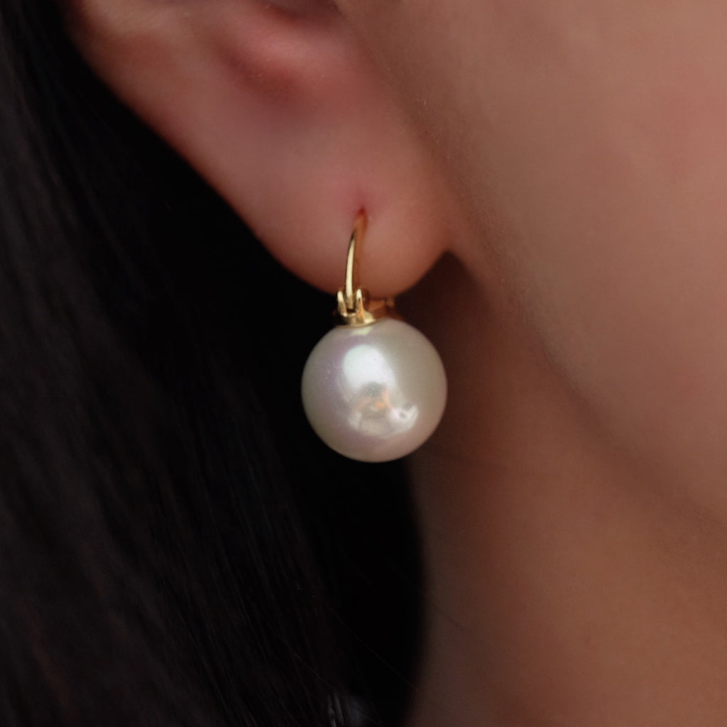 12mm white pearl earrings, crafted to enhance any outfit with their stunning luster. Perfect for everyday wear or special occasions like weddings and bridesmaid ensembles