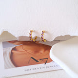 Lab-created amethyst hoop earrings with purple baguette gemstones and gold-tone huggie hoops for women