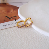 Lab-created amethyst hoop earrings with purple baguette gemstones and gold-tone huggie hoops for women