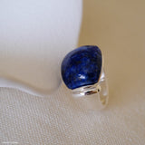 Lapis lazuli ring with deep blue gemstone and polished silver setting, blue stone statement ring for women