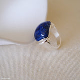 Lapis lazuli ring with deep blue gemstone and polished silver setting, blue stone statement ring for women