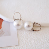 12mm white pearl drop earrings for women with round pearls and silver-tone leverback setting
