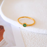 May birthstone gold emerald ring