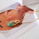 Minimalist gold jade necklace with natural green jade stone pendant and zirconia detail, delicate jewelry art7jewels