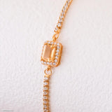 Gold citrine tennis bracelet with natural rectangular citrine center stone surrounded by small sparkling stones, delicate minimalist gemstone jewelry for women