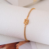 Gold citrine tennis bracelet with natural rectangular citrine center stone surrounded by small sparkling stones, delicate minimalist gemstone jewelry for women
