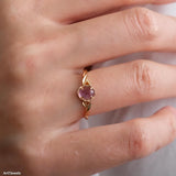 Natural amethyst ring featuring a genuine light purple oval amethyst gemstone set in a delicate gold leaf band, nature inspired February birthstone jewelry for women.