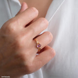 Natural amethyst ring featuring a genuine light purple oval amethyst gemstone set in a delicate gold leaf band, nature inspired February birthstone jewelry for women.
