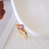 Natural amethyst ring featuring a genuine light purple oval amethyst gemstone set in a delicate gold leaf band, nature inspired February birthstone jewelry for women.