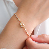 Gold citrine tennis bracelet with natural rectangular citrine center stone surrounded by small sparkling stones, delicate minimalist gemstone jewelry for women