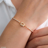 Gold citrine tennis bracelet with natural rectangular citrine center stone surrounded by small sparkling stones, delicate minimalist gemstone jewelry for women