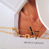 Natural citrine bracelet featuring a genuine golden yellow citrine gemstone surrounded by a sparkling halo, set on a delicate gold chain with bezel accents, elegant November birthstone jewelry for women.