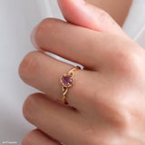 Natural amethyst ring featuring a genuine light purple oval amethyst gemstone set in a delicate gold leaf band, nature inspired February birthstone jewelry for women.