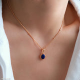 Minimalist natural blue oval lapis lazuli pendant necklace with beaded 18K gold bezel on dainty satellite chain by Art7Jewels