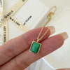 Natural malachite necklace featuring a genuine rectangular green malachite gemstone with distinctive banding in a polished gold bezel pendant on a delicate gold chain, elegant minimalist gemstone jewelry for women.